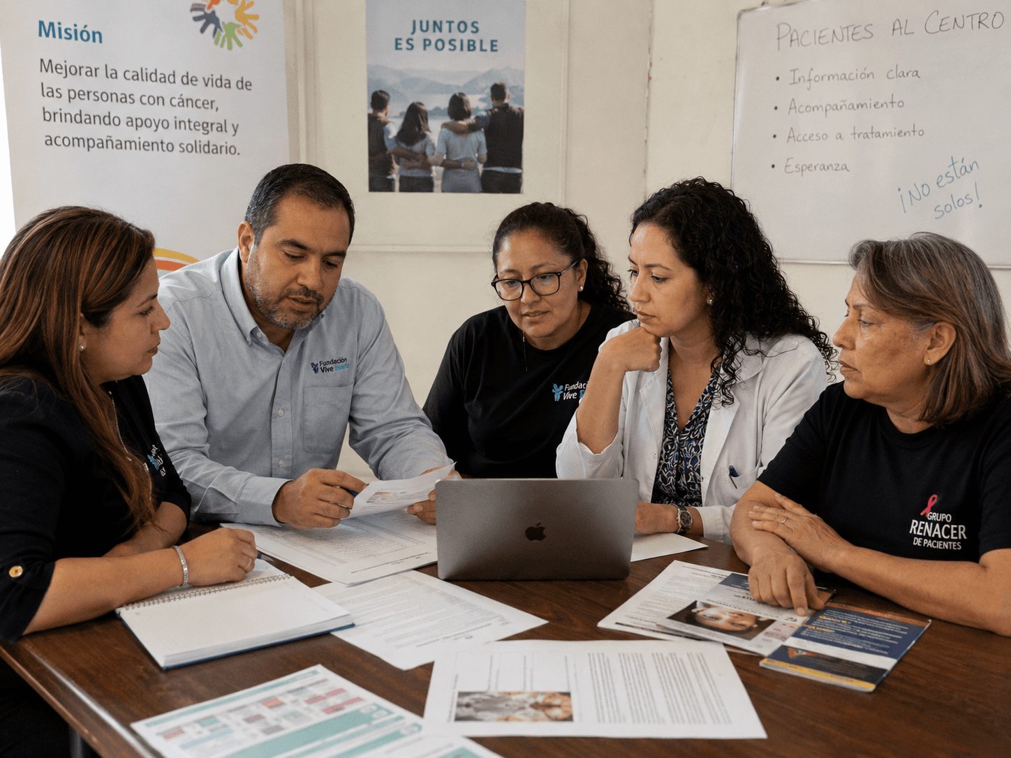 A patient support group and foundation team reviewing patient cases